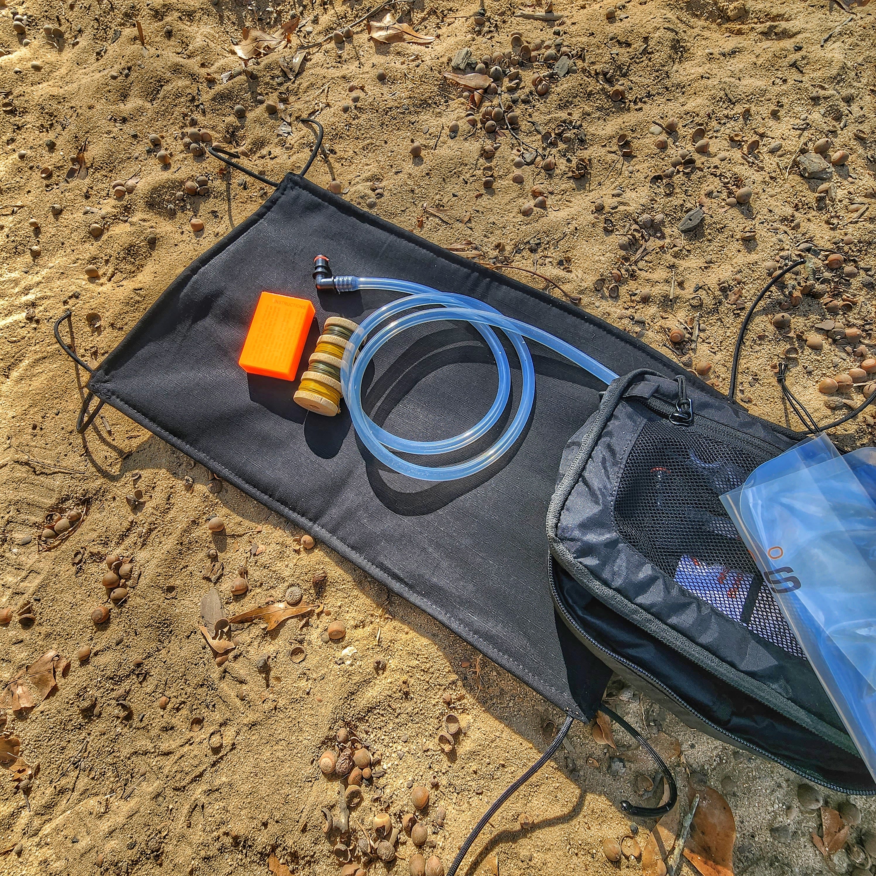Woobie Hank: Insulated with USGI poncho-liner, serves as a large rag, knee pad, and adventure companion tool. - Image 9